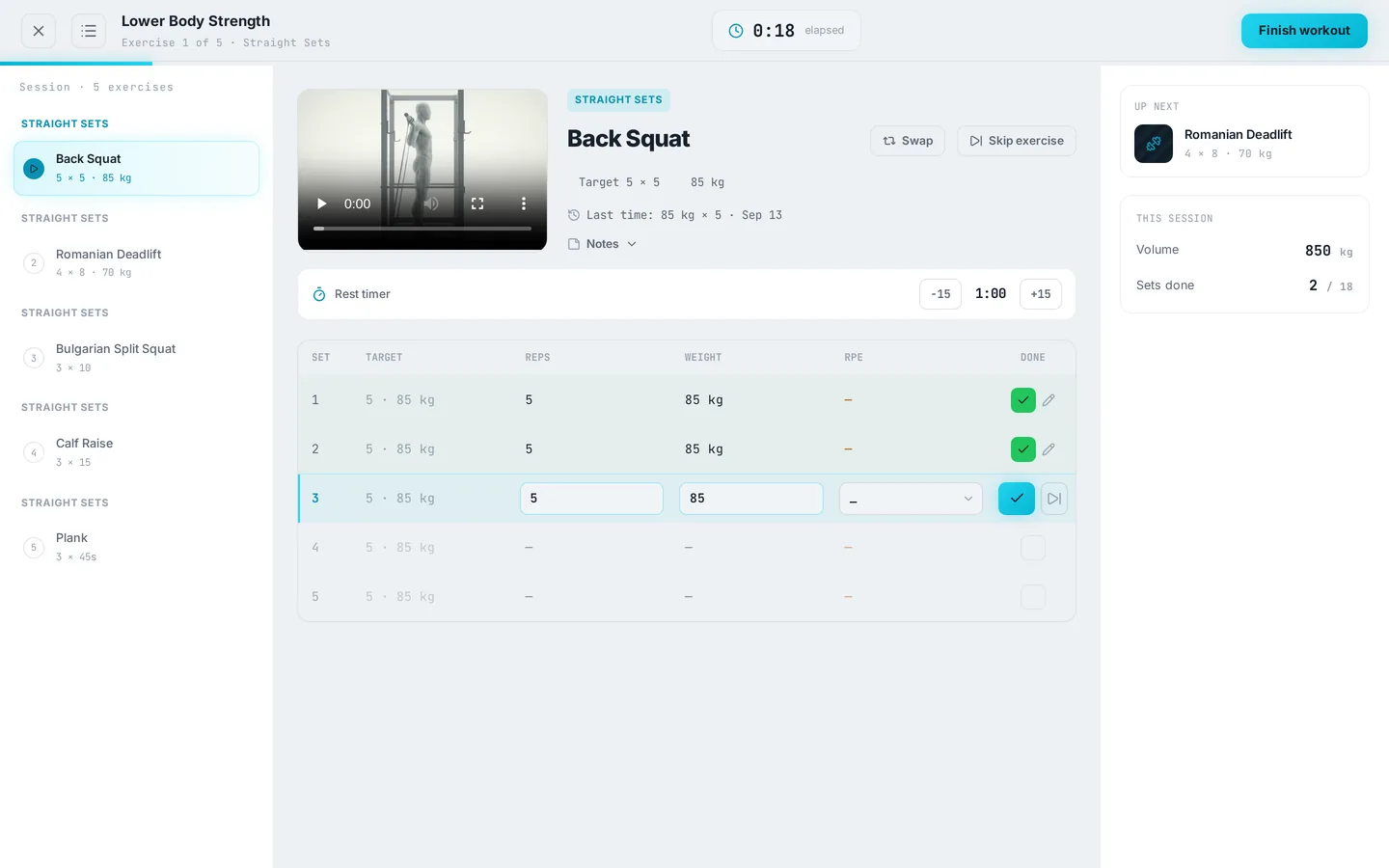 Live session screen logging a back squat with a rest timer, set table and up-next card